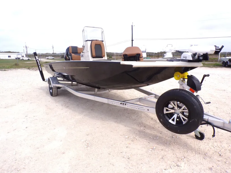 Slide: The Image of 2026 Xpress H20BAY boat on trailer, side view. - 6