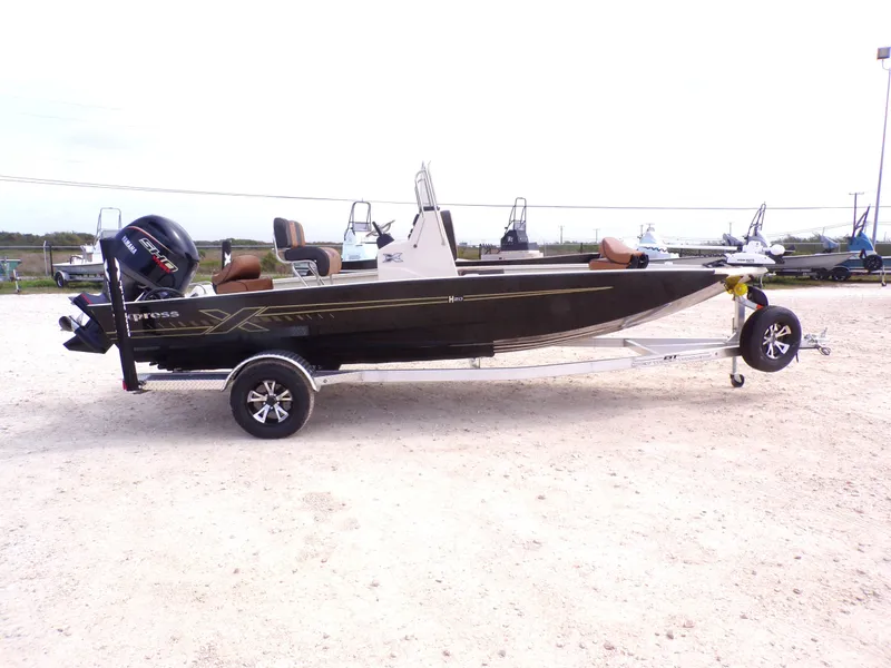 Slide: The Image of 2026 Xpress H20BAY boat on trailer, side view. - 7