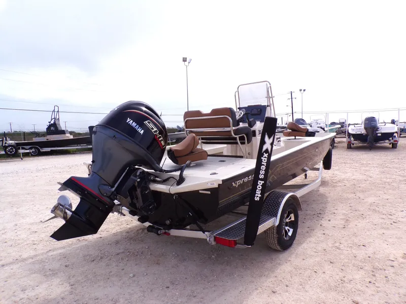 Slide: The Image of 2026 Xpress H20BAY boat with Yamaha engine on trailer. - 8