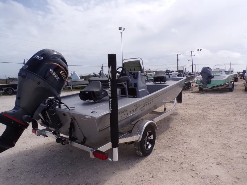 Slide: The Image of 2026 Xpress XP18CC boat with Yamaha engine on trailer. - 10