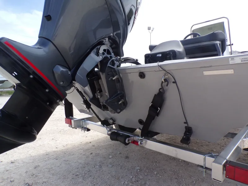 Slide: The Image of Rear view of a 2026 Xpress XP18CC boat with outboard motor. - 11