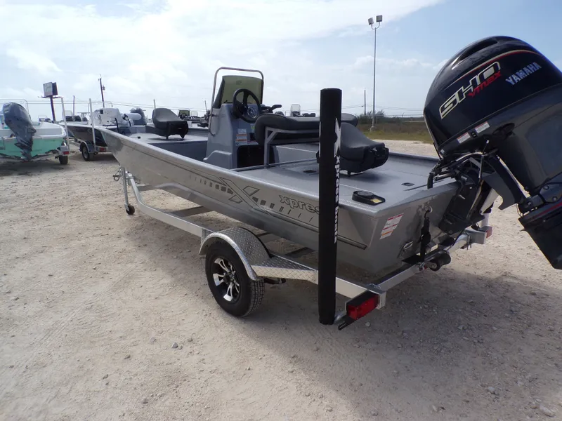 Slide: The Image of 2026 Xpress XP18CC boat with Yamaha motor on trailer. - 13