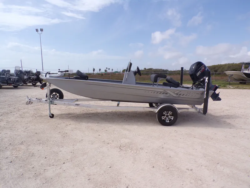 Slide: The Image of 2026 Xpress XP18CC boat on trailer, side view. - 35