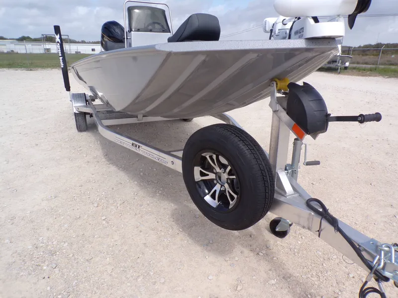 Slide: The Image of 2026 Xpress XP18CC boat on trailer, side view. - 8