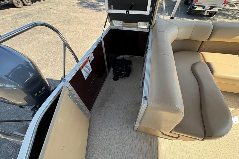 Slide: The Image of 2016 Bennington 21 SLX pontoon boat interior with seating and Yamaha 115 engine. - 12