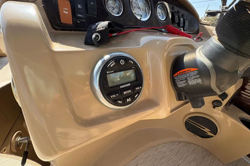 Slide: The Image of Control panel of a 2016 Bennington 21 SLX boat with audio system and gauges. - 15