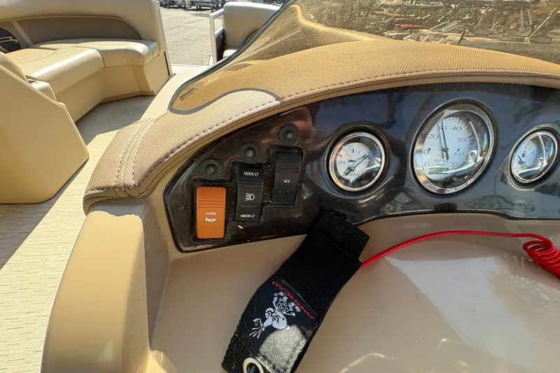 Slide: The Image of Dashboard of a 2016 Bennington 21 SLX boat with gauges and controls. - 16
