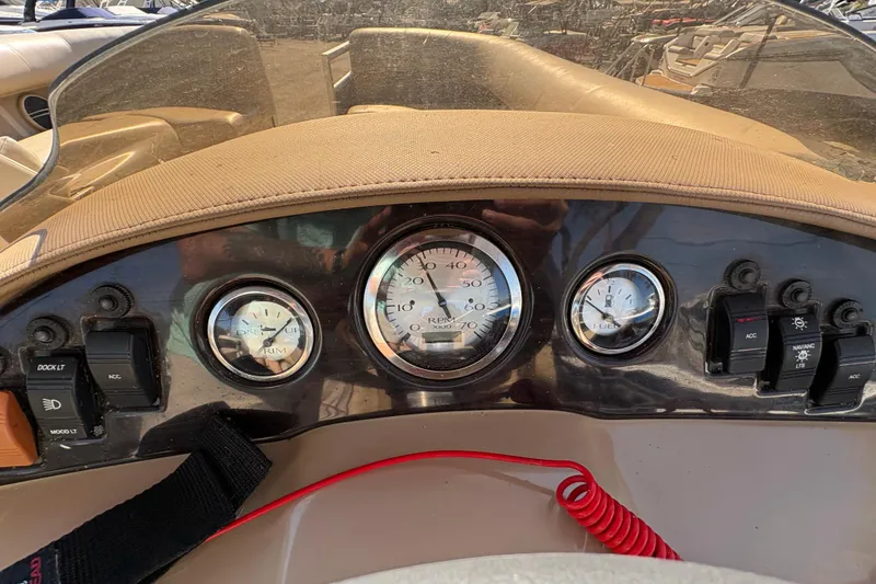 Slide: The Image of Dashboard of a 2016 Bennington 21 SLX boat with gauges and controls. - 17