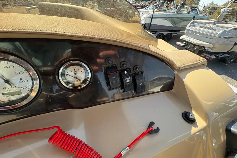 Slide: The Image of Dashboard of a 2016 Bennington 21 SLX boat with gauges and switches. - 18