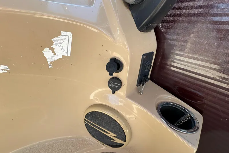 Slide: The Image of 2016 Bennington 21 SLX boat dashboard with controls and cup holder. - 20