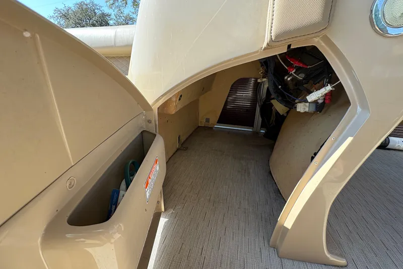 Slide: The Image of Interior view of a 2016 Bennington 21 SLX boat, showing storage and wiring. - 23