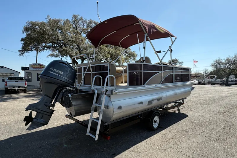 Slide: The Image of 2016 Bennington 21 SLX pontoon boat with Yamaha outboard motor on trailer. - 5