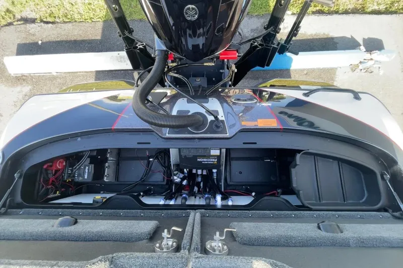 Slide: The Image of 2026 Skeeter FXR20 FLEX boat engine compartment with wiring and components visible. - 10