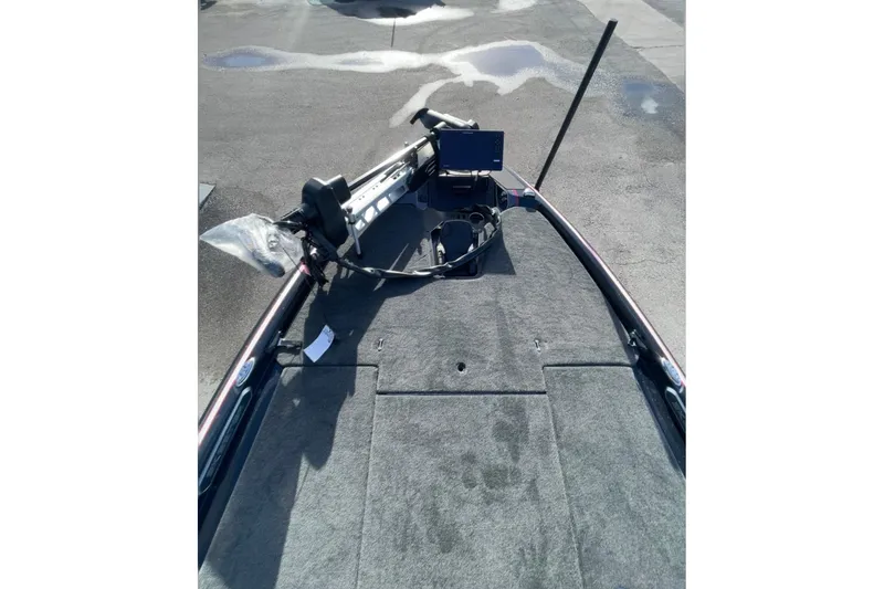 Slide: The Image of 2026 Skeeter FXR20 FLEX boat deck with trolling motor and control panel. - 13