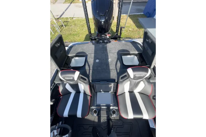 Slide: The Image of 2026 Skeeter FXR20 FLEX boat interior with dual seats and advanced dashboard. - 14