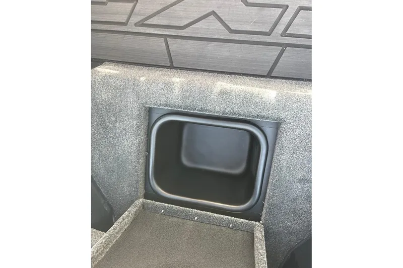 Slide: The Image of 2026 Skeeter FXR20 FLEX boat storage compartment with textured interior design. - 17