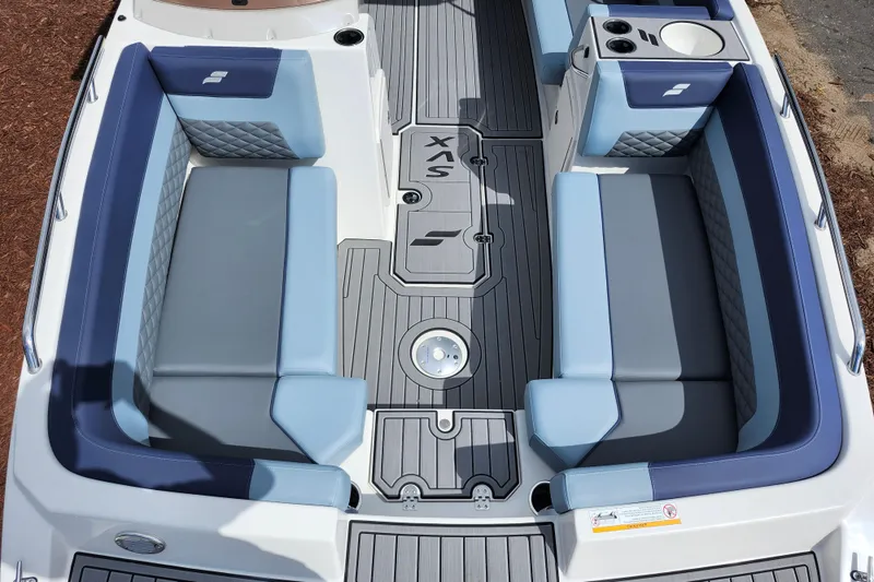 Slide: The Image of 2026 Starcraft SVX 211 OB boat interior with blue and gray seating and modern design. - 11