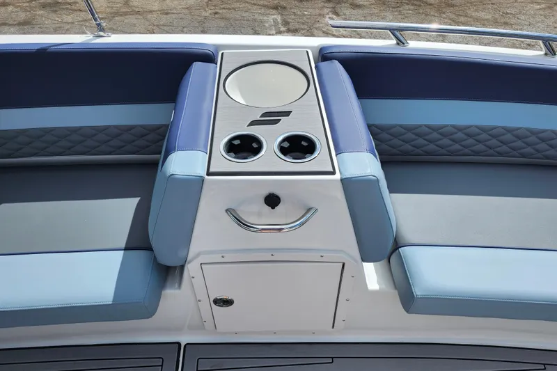 Slide: The Image of 2026 Starcraft SVX 211 OB boat interior with blue seating and cup holders. - 14
