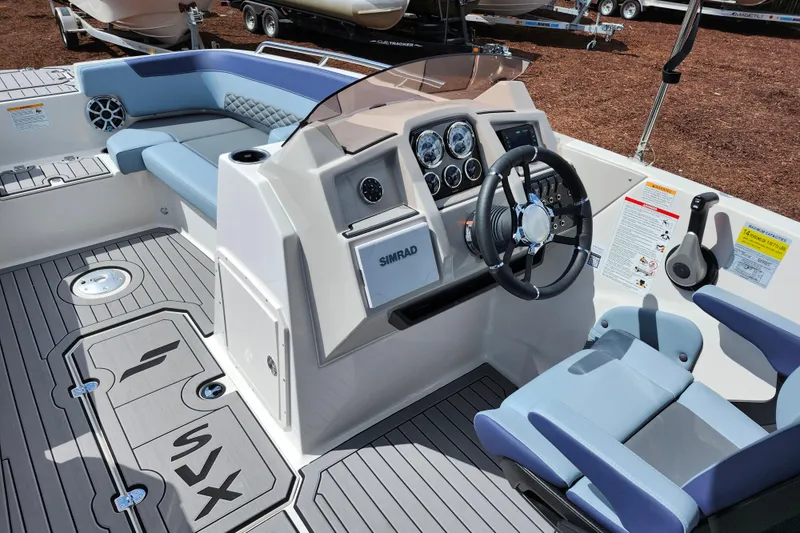 Slide: The Image of 2026 Starcraft SVX 211 OB boat interior with modern dashboard and seating. - 15
