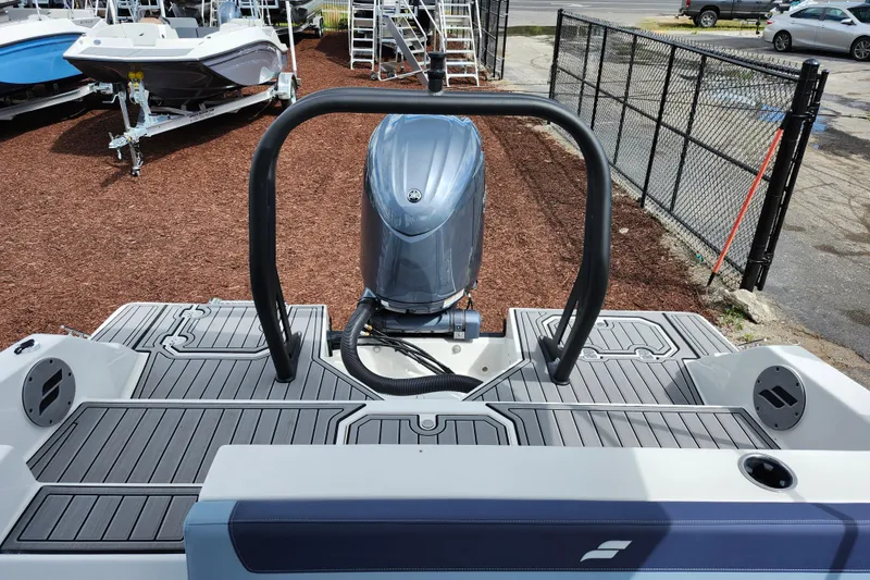 Slide: The Image of 2026 Starcraft SVX 211 OB boat with sleek deck and powerful outboard motor. - 20