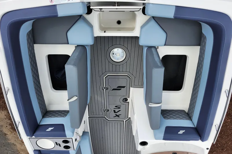 Slide: The Image of 2026 Starcraft SVX 211 OB boat interior with blue and gray seating and flooring. - 22