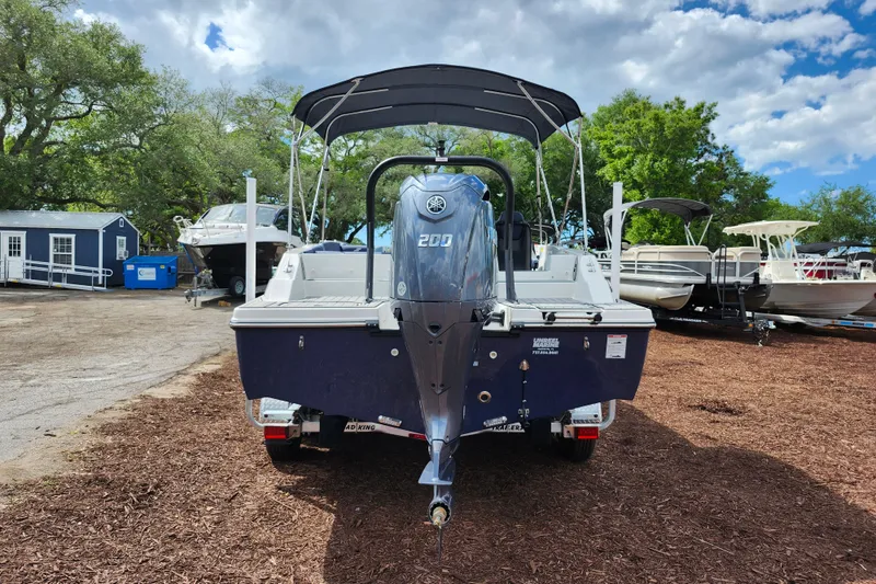 Slide: The Image of 2026 Starcraft SVX 211 OB boat with Yamaha 200 engine, parked outdoors. - 6