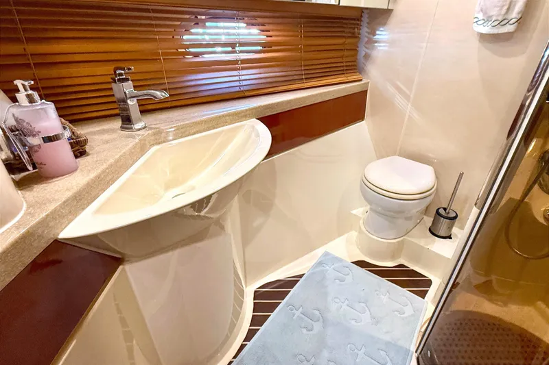 Slide: The Image of Luxurious bathroom in 2000 Fairline Squadron 55 yacht with modern fixtures and elegant design. - 16