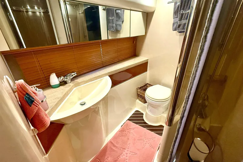Slide: The Image of Luxurious bathroom in 2000 Fairline Squadron 55 yacht with modern fixtures and elegant decor. - 17