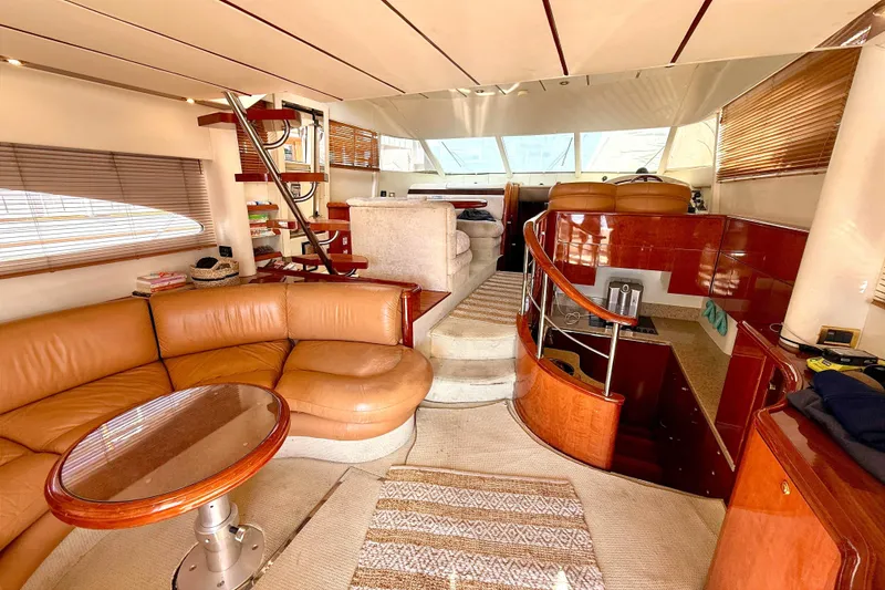 Slide: The Image of Luxurious interior of 2000 Fairline Squadron 55 yacht with leather seating and wooden accents. - 3