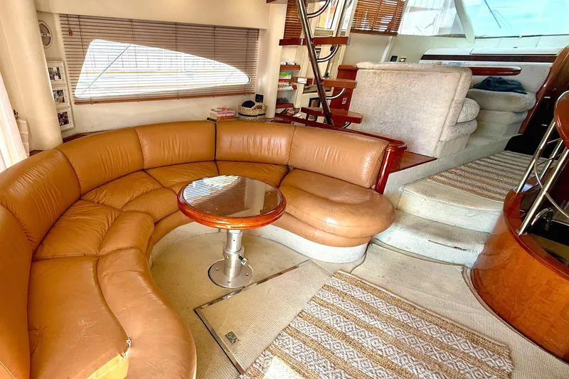 Slide: The Image of Luxurious interior of 2000 Fairline Squadron 55 yacht with leather seating and wooden accents. - 4