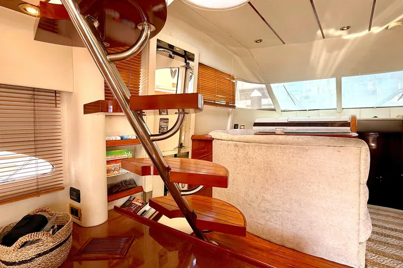 Slide: The Image of Luxurious interior of 2000 Fairline Squadron 55 yacht with wooden staircase and cozy seating. - 6