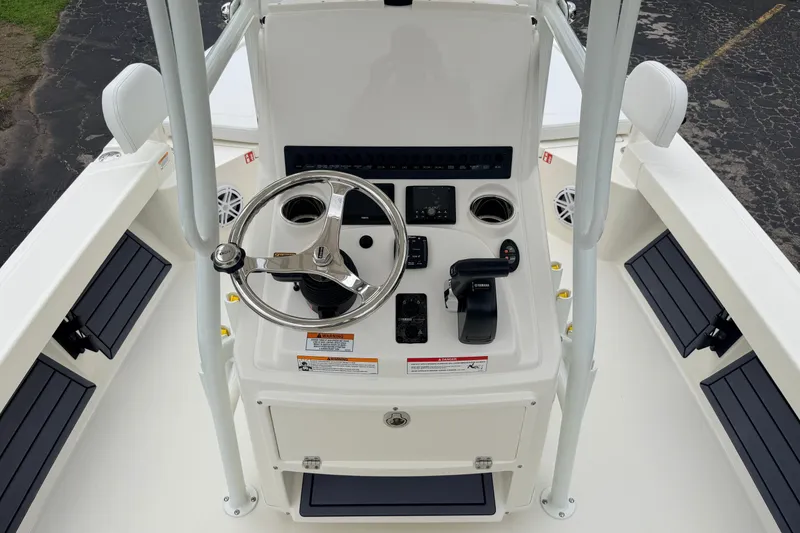 Slide: The Image of 2026 Pathfinder 2200 TRS boat console with steering wheel and controls. - 11