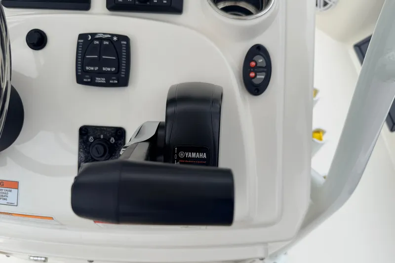 Slide: The Image of Control panel of 2026 Pathfinder 2200 TRS boat featuring Yamaha throttle system. - 13