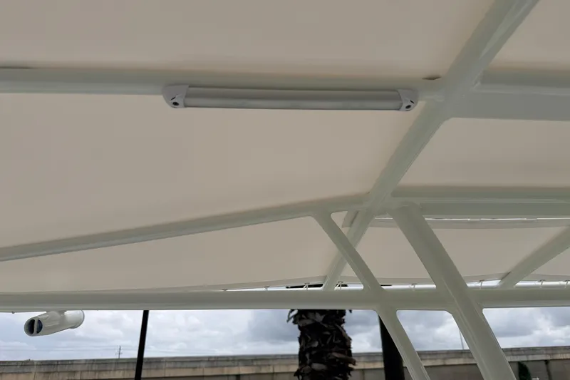 Slide: The Image of 2026 Pathfinder 2200 TRS boat canopy with integrated lighting, showcasing sleek design. - 15