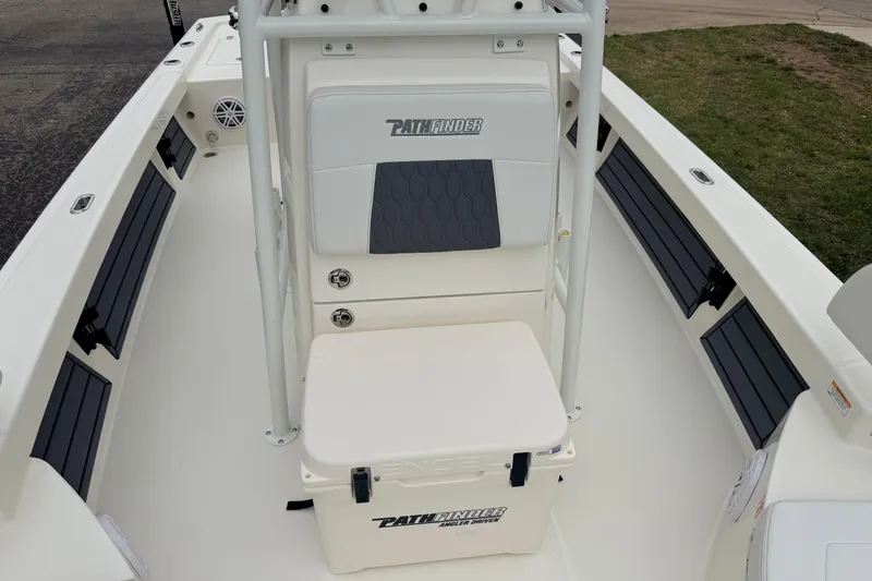 Slide: The Image of 2026 Pathfinder 2200 TRS boat interior with seating and storage. - 18