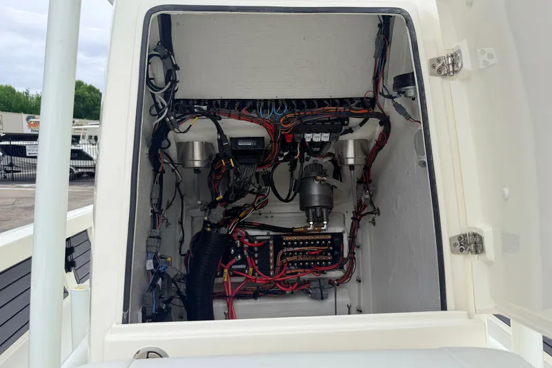 Slide: The Image of Electrical wiring inside a 2026 Pathfinder 2200 TRS boat compartment. - 22
