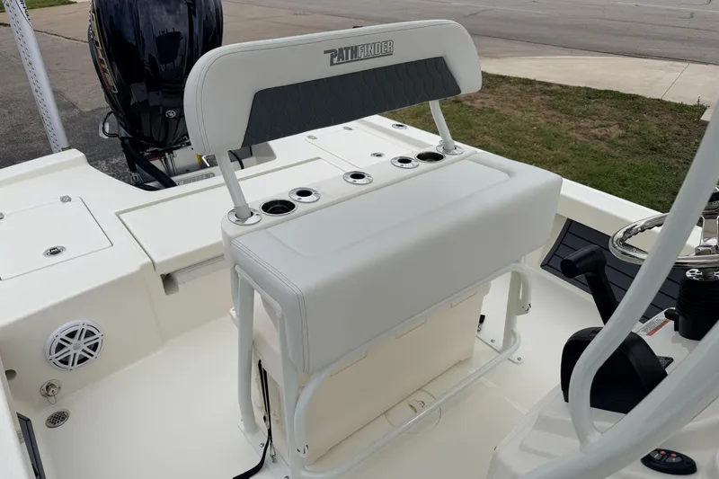 Slide: The Image of 2026 Pathfinder 2200 TRS boat interior with seating and steering console. - 23