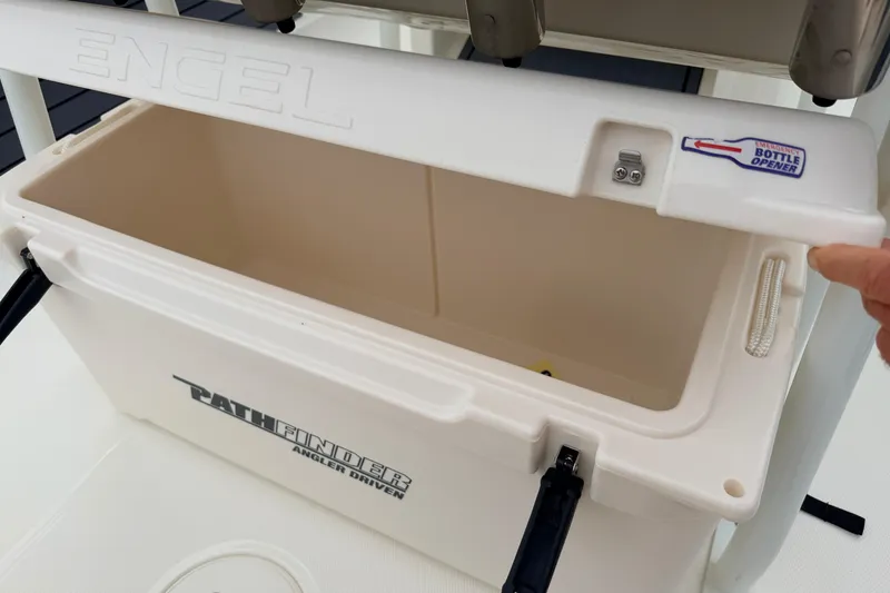 Slide: The Image of Open Engel cooler on 2026 Pathfinder 2200 TRS boat with built-in bottle opener. - 26