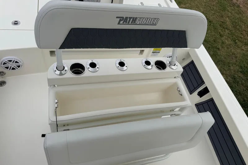 Slide: The Image of 2026 Pathfinder 2200 TRS boat seat with integrated rod holders and storage compartment. - 29