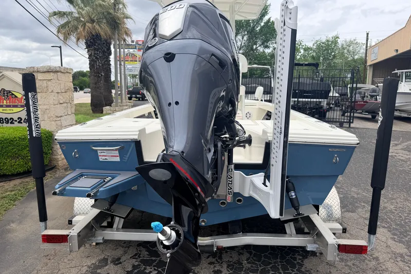 Slide: The Image of 2026 Pathfinder 2200 TRS boat on trailer, featuring powerful outboard motor. - 3