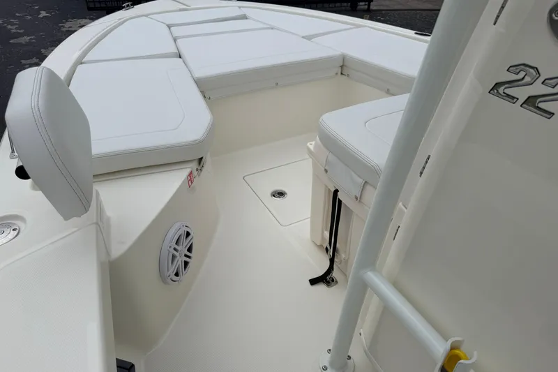 Slide: The Image of 2026 Pathfinder 2200 TRS boat interior with white seating and deck details. - 30