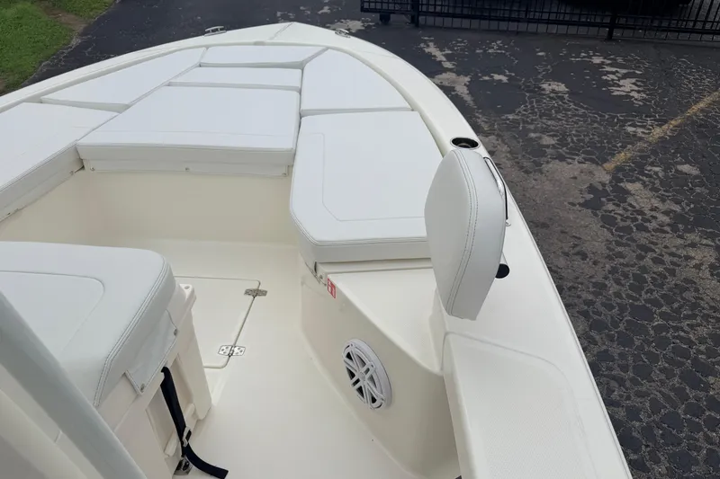 Slide: The Image of 2026 Pathfinder 2200 TRS boat interior with white seating and storage compartments. - 32
