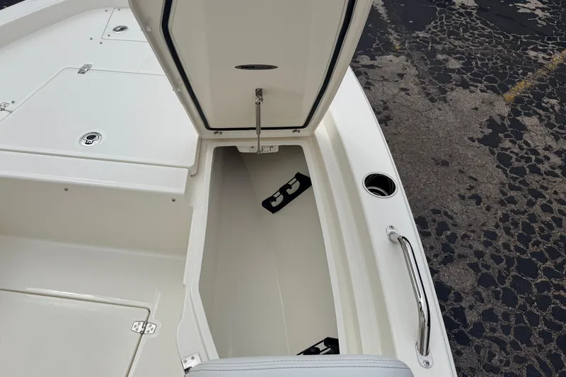 Slide: The Image of Open storage compartment on 2026 Pathfinder 2200 TRS boat, showcasing spacious interior design. - 39