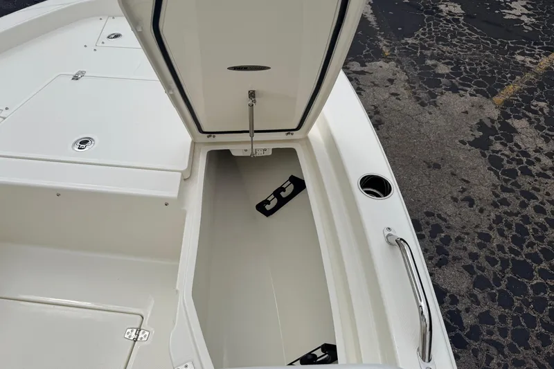 Slide: The Image of Open storage compartment on 2026 Pathfinder 2200 TRS boat, showcasing spacious interior design. - 40