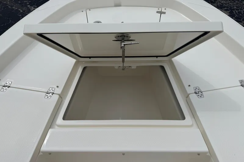 Slide: The Image of Open storage compartment on 2026 Pathfinder 2200 TRS boat deck. - 42
