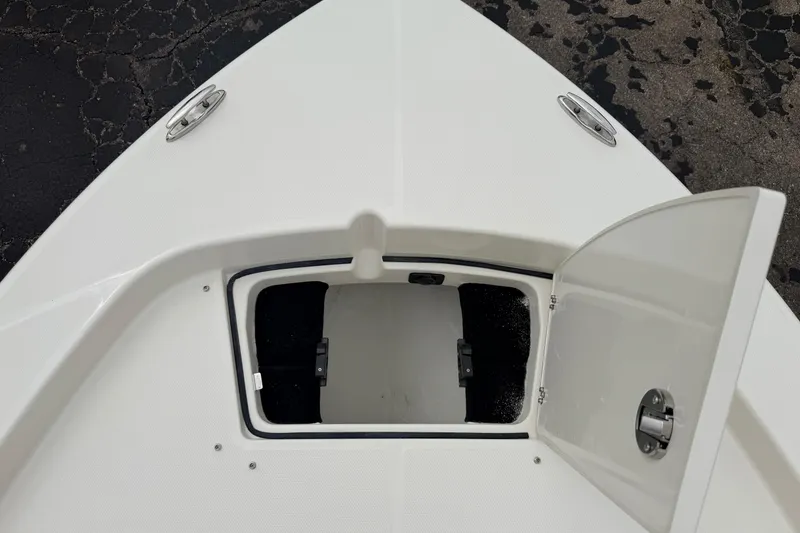 Slide: The Image of Open storage compartment on 2026 Pathfinder 2200 TRS boat deck. - 44