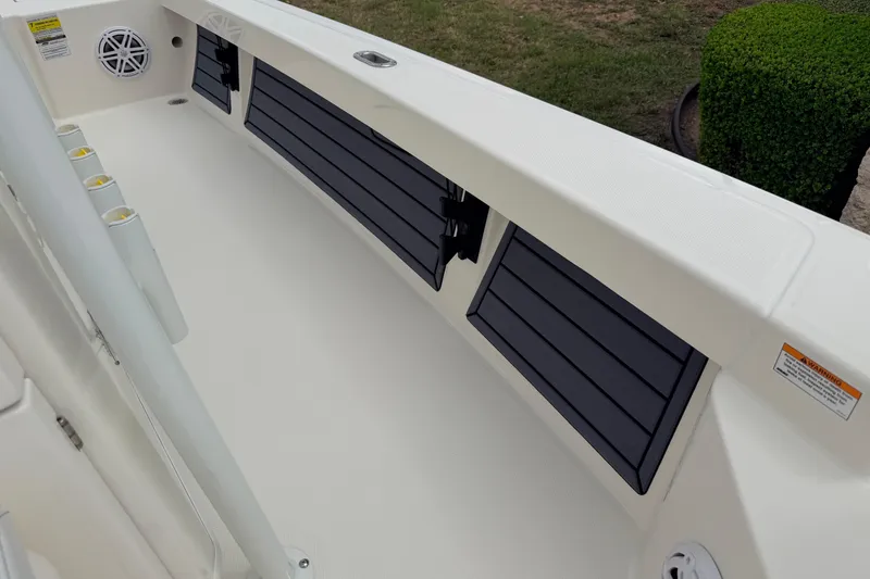 Slide: The Image of 2026 Pathfinder 2200 TRS boat interior with rod holders and storage compartments. - 45