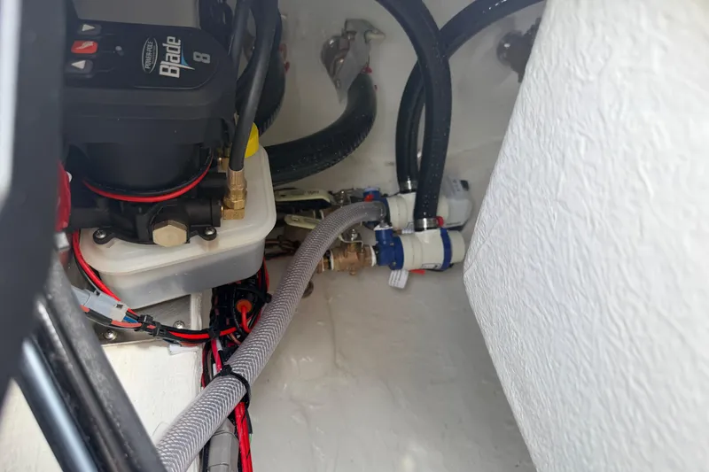 Slide: The Image of Electrical and plumbing components inside a 2026 Pathfinder 2200 TRS boat. - 51