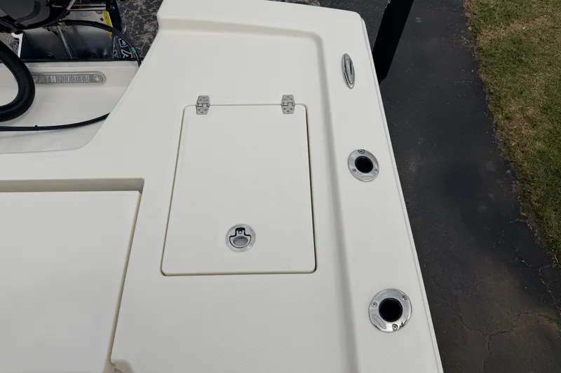 Slide: The Image of 2026 Pathfinder 2200 TRS boat deck with storage hatch and rod holders. - 52