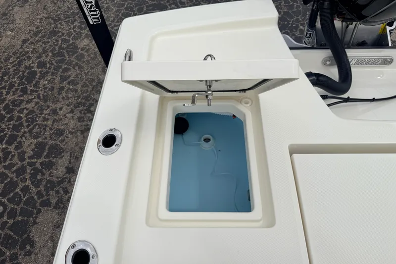 Slide: The Image of 2026 Pathfinder 2200 TRS boat with open livewell, showcasing interior design and functionality. - 55